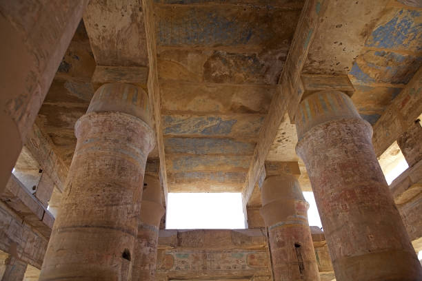 Columns in the Hypostyle Hall at the Karnak Temple Complex in Luxor, Egypt. The Complex cpmprises a vast mix of temples, pylons, chapels and other buildings. Construction began during the reign of Senusret I, who reigned 1971-1926 BCE.
