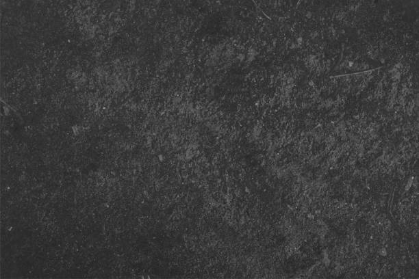 istock Textured effect empty blank messy uneven rough smudged wall with abstract dirt asphalt road texture vector horizontal background in dark gray black color 2058118130