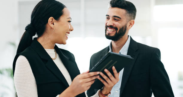 istock Teamwork, tablet and business people in office for advice, project management and planning review. Man, woman and happy corporate employees with digital technology for feedback, collaboration or talk 2058126554