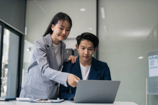 istock Teamwork process, Business team using a calculator to calculate the numbers of statistic business profits growth rate on documents graph data, desk in the office. 2058136497
