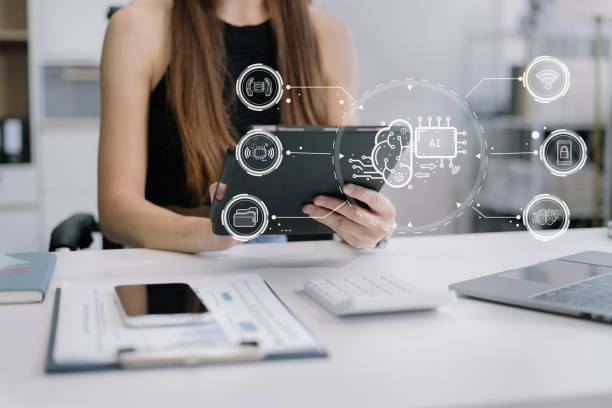 istock Business woman using a smartphone and laptop computer chatting with an intelligent artificial intelligence. 2058136524
