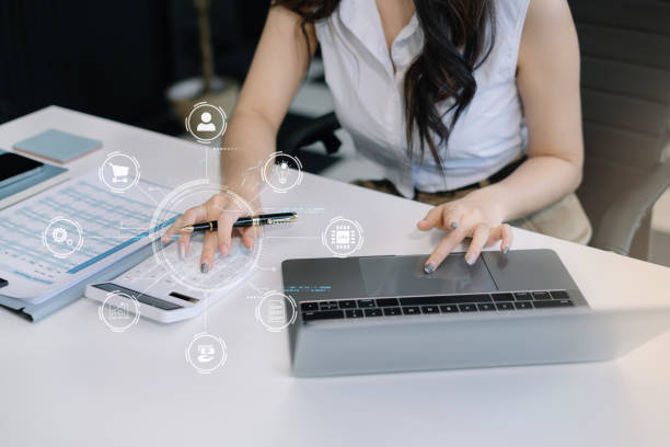 istock Business woman or accountant working on laptop computer with business document, graph diagram and calculator on office table in office. 2058137610