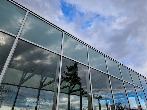 modern corporate glass building,  cross processing,