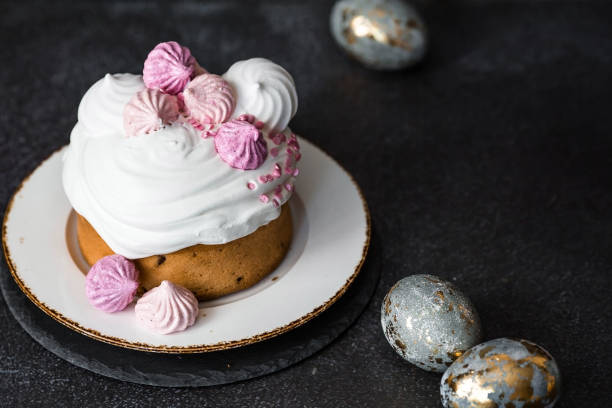 istock Beautiful stylish still life. Easter cake with meringue, marshmallows, and Easter eggs on a dark background. happy Easter 2024. 2058149486