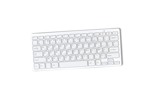 Modern aluminum computer keyboard isolated on white background