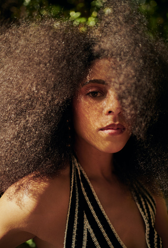 Portrait of a beautiful woman with afro hair. Stock photo