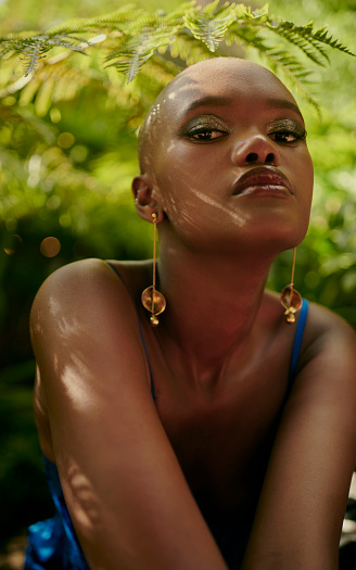Portrait of a beautiful African woman in a lush garden