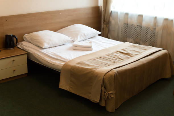 istock Small cozy soft bed for two people 2058173652