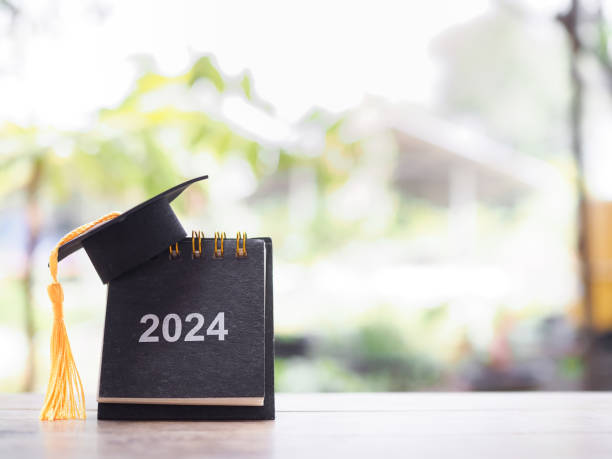 istock Study goals, 2024 Desk calendar with graduation hat. The concept for Resolution, Goal, Action, Planning, and manage time to success graduate. 2058175850