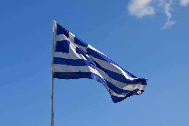 istock Greek national flag in the wind 2058206528