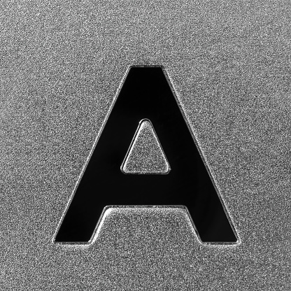 Letter A on a silver grained shiny metal surface. English alphabet. Element for design.