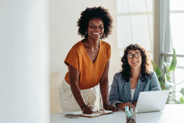 istock Diverse female entrepreneurs collaborating in a modern office setting 2058232461
