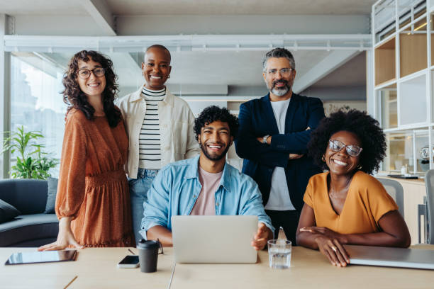 istock Portrait of a successful modern business team in a creative, collaborative office workspace 2058233043