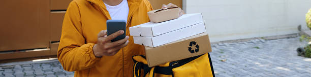 istock Delivery Man Checking Address of Customer 2058257769