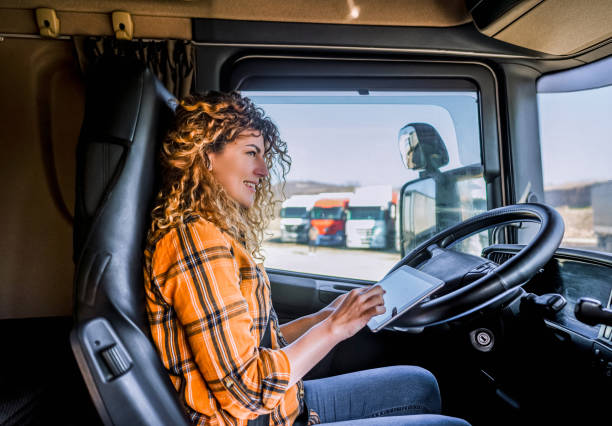 istock Female truck driver using a digital tablet 2058284047