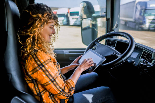 istock Female truck driver using a digital tablet 2058286216