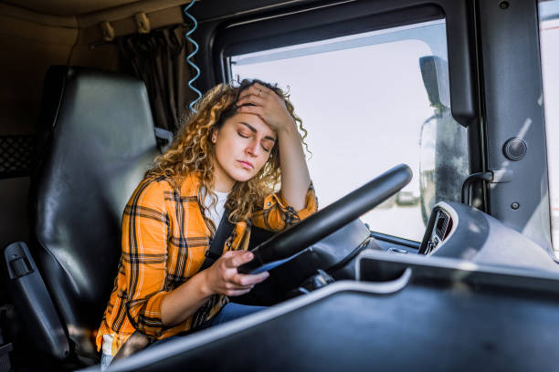 istock Tired truck driver having a headache after working extra hours 2058287834