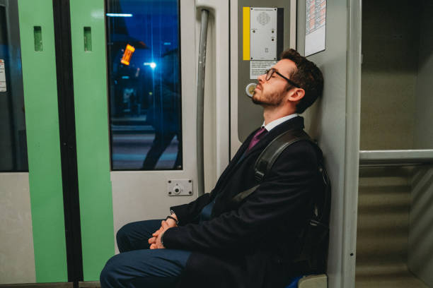 istock A tired businessman is going to work with a train 2058297756