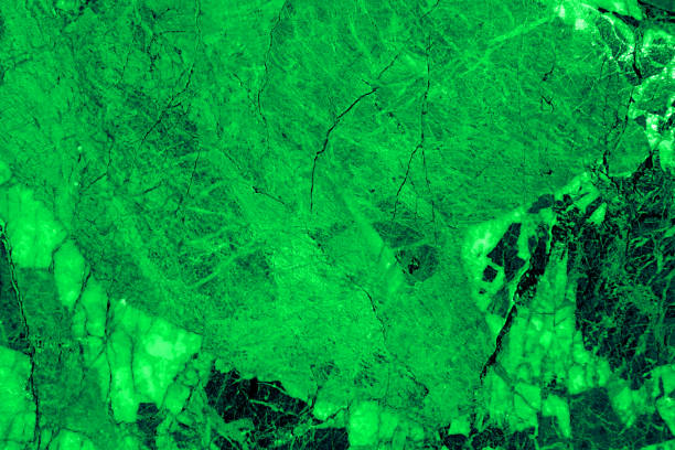 Seamless pattern texture background of a green marble backdrop.