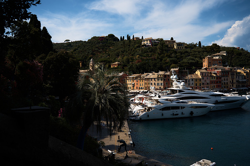 the streets, bays and yachts on the charming coast of Portofino in northern Italy on a summer day