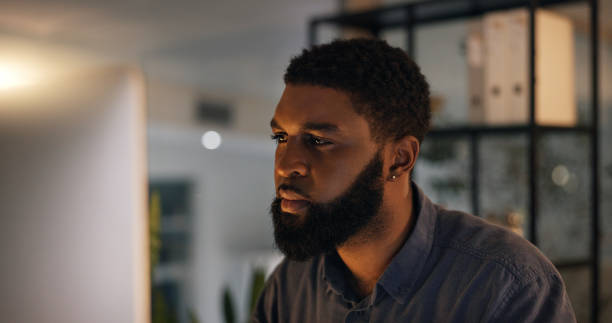 istock Business, night and thinking with black man, computer and professional with stress and decision. African person, entrepreneur and consultant with pc and brainstorming with choice, email and planning 2058303505