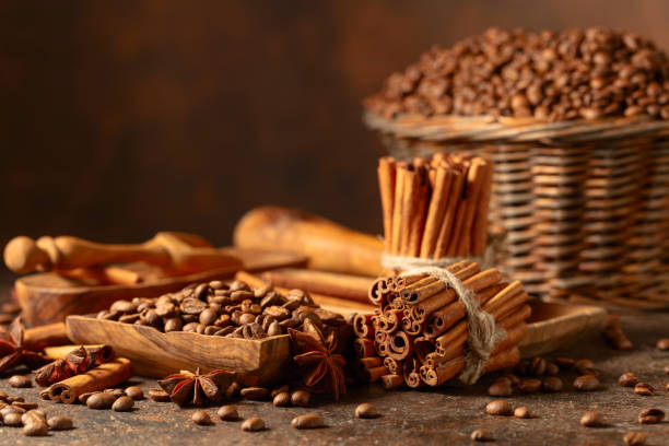 istock Coffee beans with spices on a brown vintage background. 2058312029