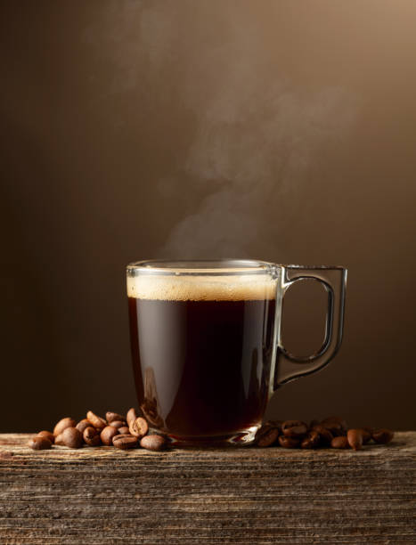 istock Espresso coffee glass cup on a brown background. 2058312224