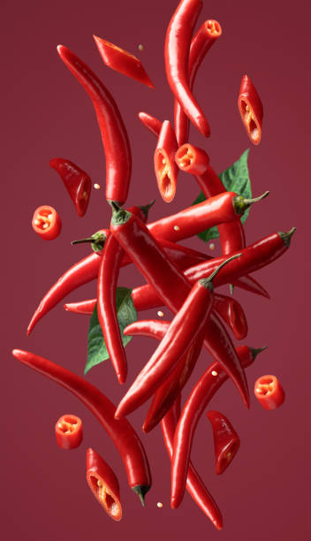 istock Red chili peppers in motion. 2058313296