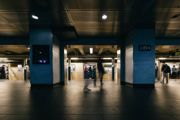 People in a NYC subway station waiting for the train