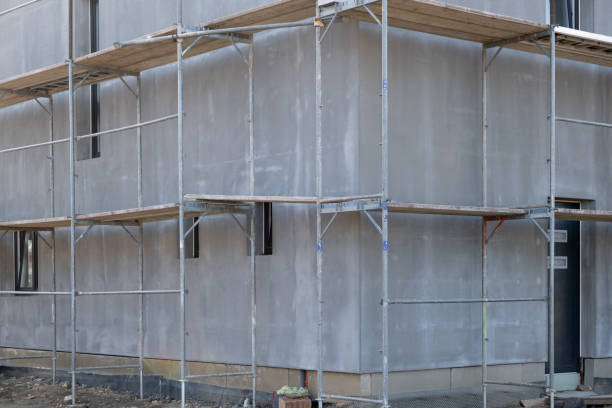 istock Finished insulation of cold barrier in facade before painting on Construction site. Modern Building technologies and construction materials. Scaffolding around the wall. 2058326458