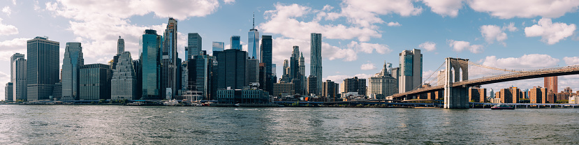 View of New York Financial District with Brooklyn Bridge on foreground.