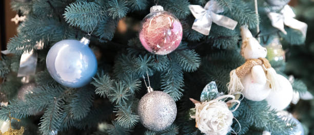 istock Christmas tree decorated with ornaments close up 2058338973