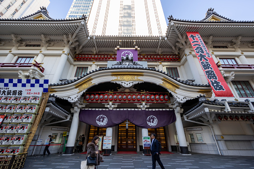 Tokyo, Japan - December 21, 2023 : Pedestrians walk past the Kabuki-Za Theater in Tokyo, Japan.