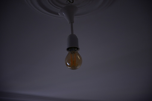 lamp hanging in a dark room