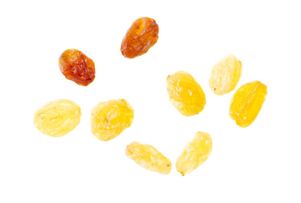 yellow raisins isolated on white background. Top view. Flat lay pattern