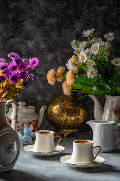 picture of a turkish coffee cup on a gray background with porcelain utensils - coffee table non alcoholic beverage turkish coffee black coffee ストックフォトと画像