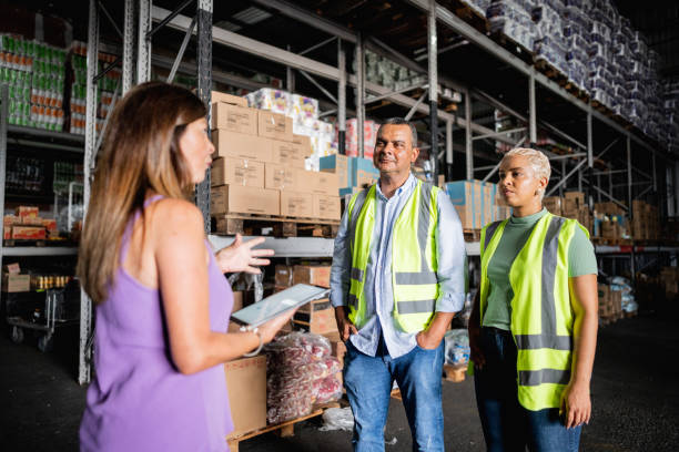 istock CEO/Director talking with employees at warehouse 2058370756
