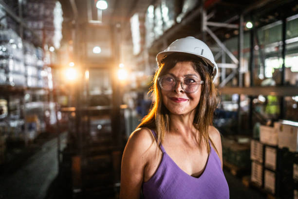 istock Mature woman working at warehouse 2058373563