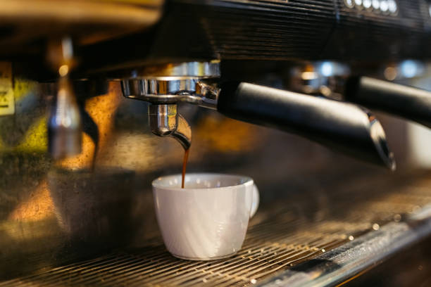 istock Coffee Being Poured In A Cup In A Coffee Shop 2058383883