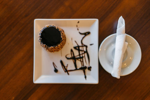 A chocolate dessert on the table in a pub.