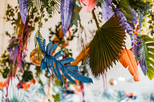 Colorful leaf decorations in a café indoors.