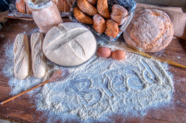 Fresh baked bread and wheat in a studio setting