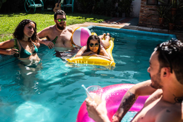 istock Friends talking during pool party at home 2058388678