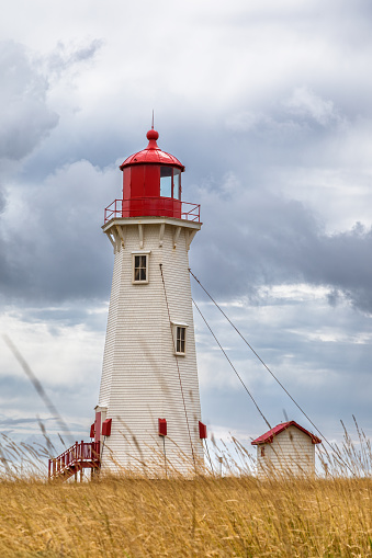 The Anse a la Cabane, or Millerand lighthouse of Havre Aubert, in Iles de la Madeleine, or the Magdalen Islands, Canada. This is the tallest and oldest working lighthouse of the archipelago.