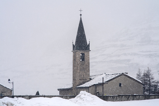 Church under the snow and fog