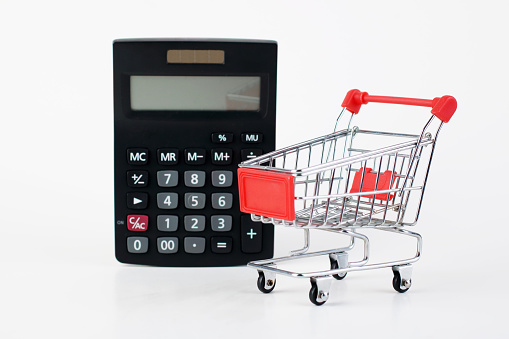 Shopping cart with calculator . Shopping concept ,price compare sale