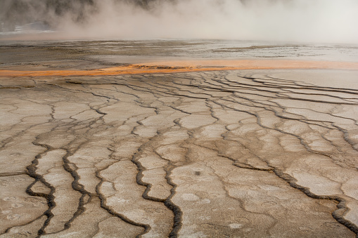 An up-close detail of the fascinating and complex patterns created by geothermal activity in Grand Prismatic Spring Overlook in Yellowstone