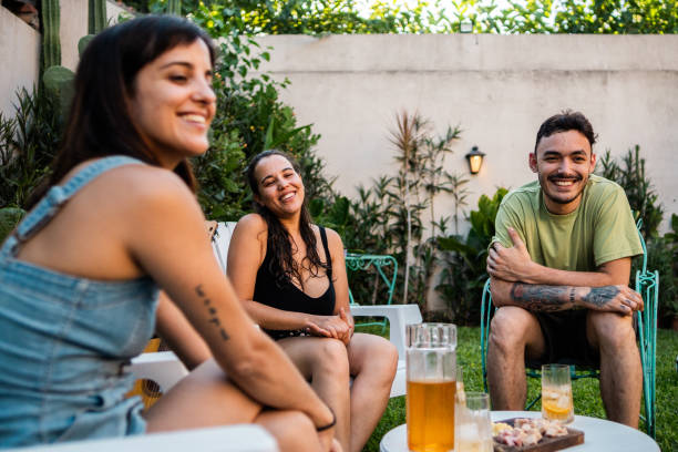 istock Friends talking in the backyard at home 2058402511
