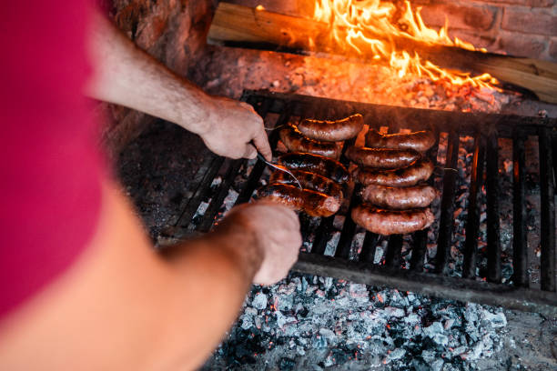 Sausages being prepared on the barbecue grill