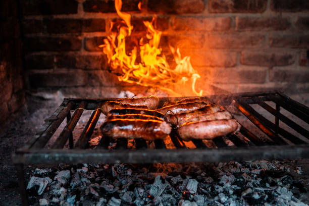 Sausages being prepared on the barbecue grill